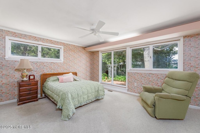 bedroom featuring wallpapered walls, carpet floors, baseboards, a ceiling fan, and ornamental molding