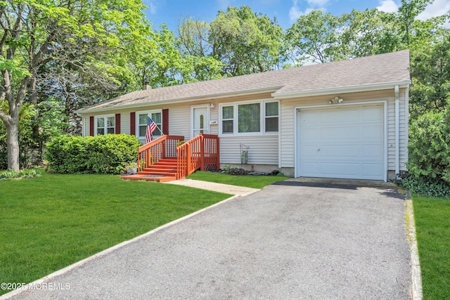ranch-style home with driveway, an attached garage, and a front lawn