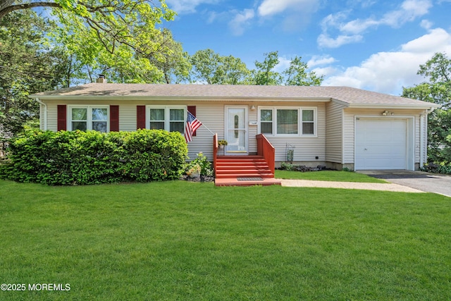 single story home with an attached garage, asphalt driveway, and a front yard