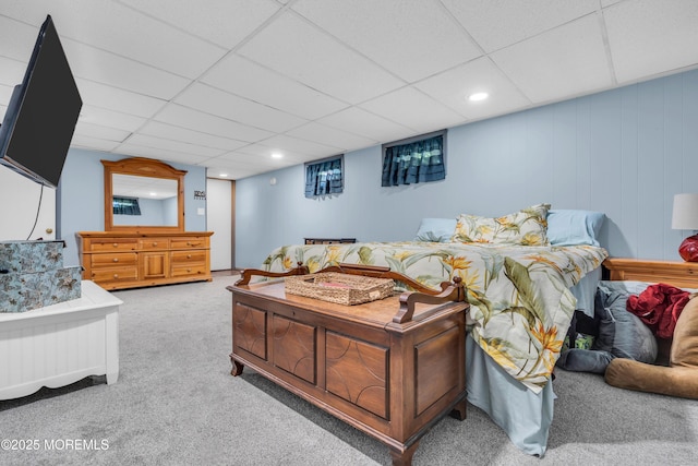 carpeted bedroom with a drop ceiling and recessed lighting