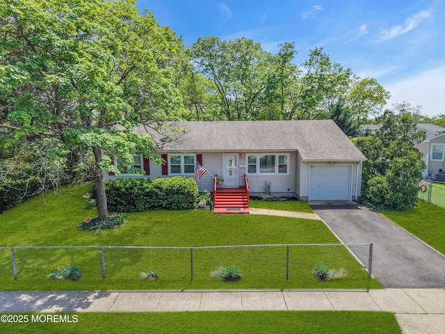 view of front of property with an attached garage and asphalt driveway