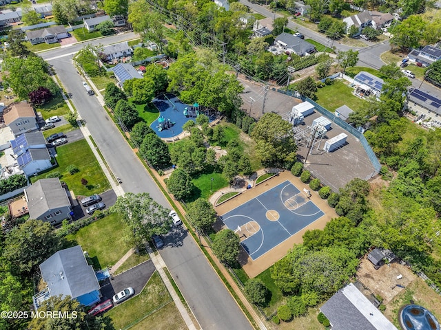 aerial overview of property's location featuring a pool and nearby suburban area