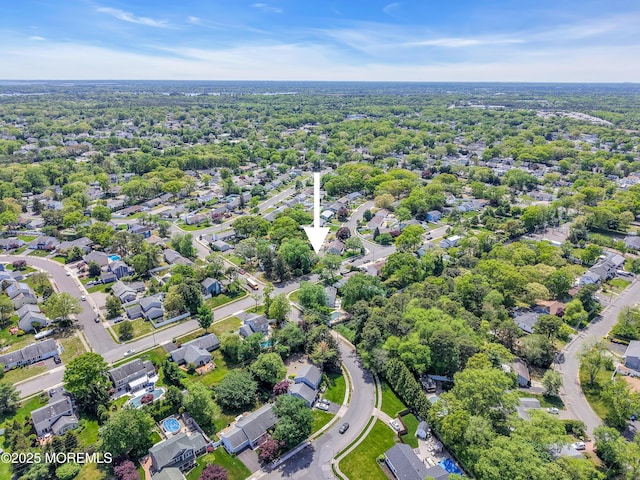 aerial view of property's location with nearby suburban area