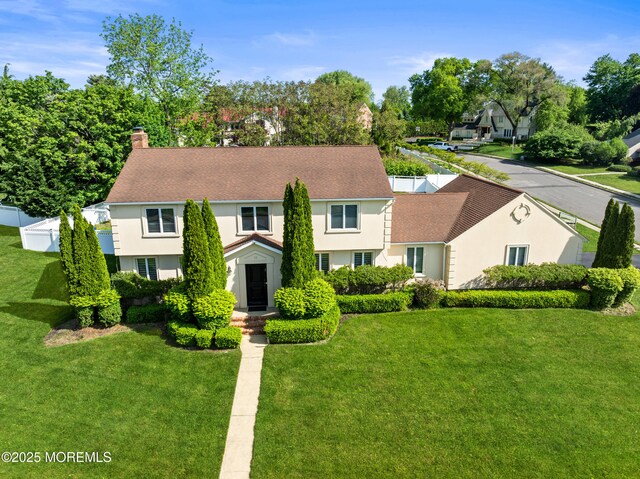 16 Bridle Dr, West Long Branch, NJ 07764 - view of front of house featuring stucco siding, a chimney, and roof with shingles