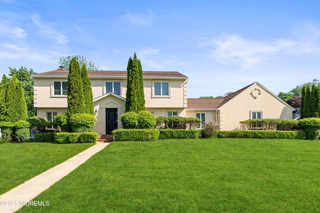 16 Bridle Dr, West Long Branch, NJ 07764 - view of front facade featuring stucco siding and a front lawn