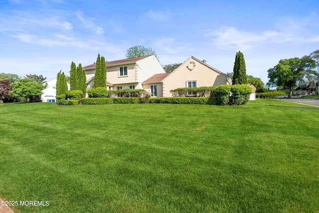 16 Bridle Dr, West Long Branch, NJ 07764 - view of front of house with stucco siding and a front yard