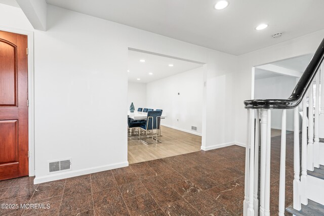 16 Bridle Dr, West Long Branch, NJ 07764 - hall with recessed lighting, baseboards, granite floors, and stairway