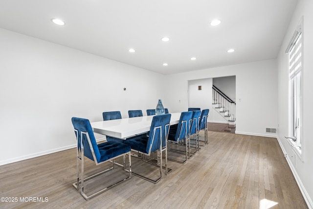 16 Bridle Dr, West Long Branch, NJ 07764 - dining space featuring light wood finished floors, stairway, baseboards, recessed lighting, and plenty of natural light