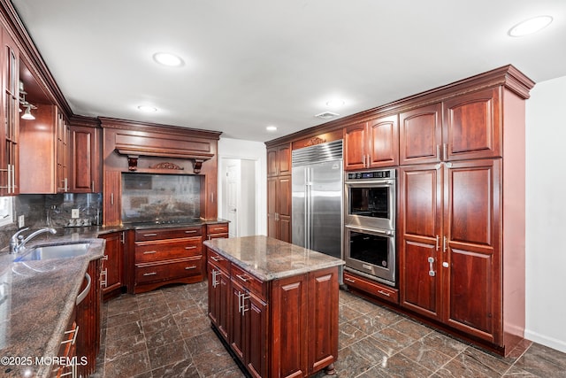 16 Bridle Dr, West Long Branch, NJ 07764 - kitchen featuring a sink, stainless steel appliances, backsplash, baseboards, and dark stone countertops