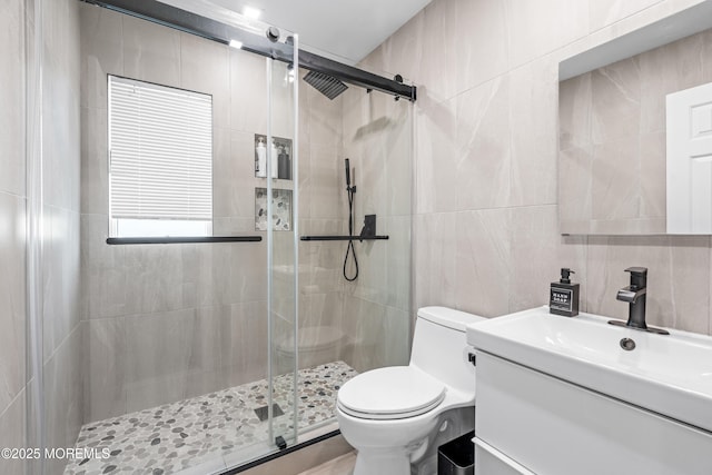 16 Bridle Dr, West Long Branch, NJ 07764 - bathroom featuring tile walls, a shower stall, toilet, and vanity
