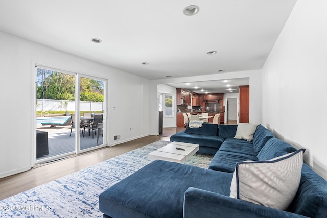 16 Bridle Dr, West Long Branch, NJ 07764 - living area featuring healthy amount of natural light, light wood-style flooring, recessed lighting, and baseboards