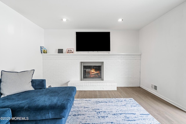 16 Bridle Dr, West Long Branch, NJ 07764 - living room with wood finished floors, baseboards, a fireplace, and recessed lighting