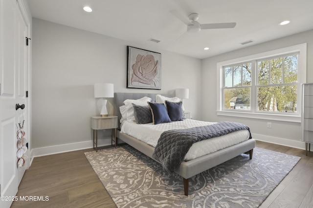 bedroom with wood finished floors, baseboards, recessed lighting, and ceiling fan