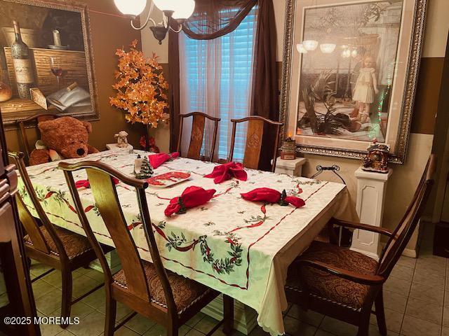 1108 Lilly Ln, Jackson, NJ 08527 - dining area with tile patterned floors and a chandelier