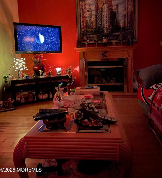 1108 Lilly Ln, Jackson, NJ 08527 - living area with a glass covered fireplace and wood finished floors