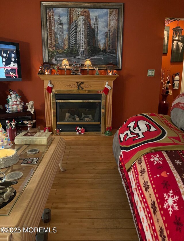1108 Lilly Ln, Jackson, NJ 08527 - living area with a glass covered fireplace and wood finished floors