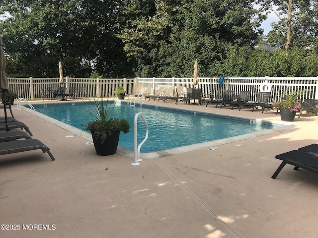 6 Tower Rd, Long Branch, NJ 07740 - community pool featuring a patio and view of scattered trees