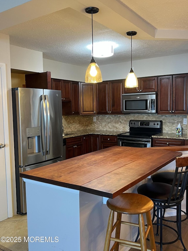 1 Channel Dr Unit 1203, Monmouth Beach, NJ 07750 - kitchen with wooden counters, appliances with stainless steel finishes, dark brown cabinets, backsplash, and a textured ceiling