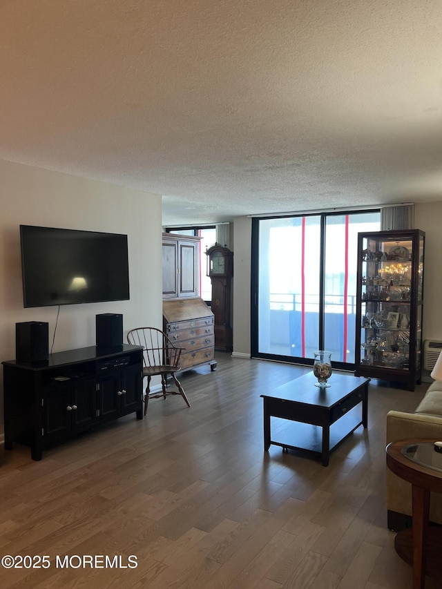 1 Channel Dr Unit 1203, Monmouth Beach, NJ 07750 - living room featuring wood finished floors, a textured ceiling, and floor to ceiling windows