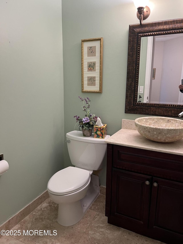 1 Channel Dr Unit 1203, Monmouth Beach, NJ 07750 - bathroom with baseboards, toilet, and vanity