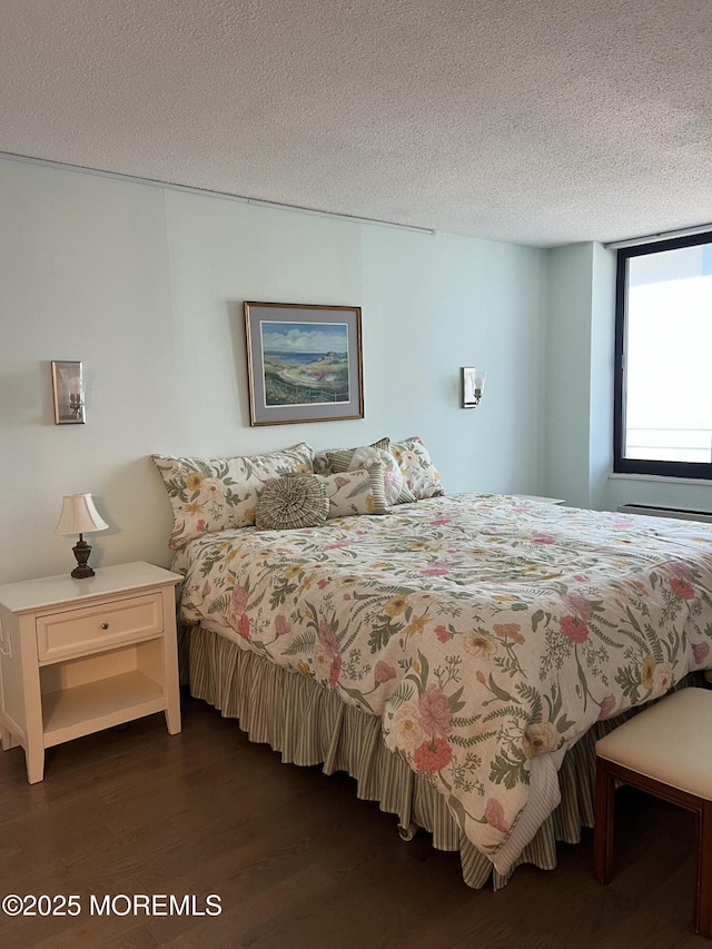 1 Channel Dr Unit 1203, Monmouth Beach, NJ 07750 - bedroom with dark wood-style floors and a textured ceiling