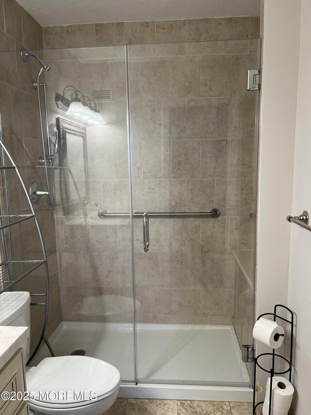 1 Channel Dr Unit 1203, Monmouth Beach, NJ 07750 - bathroom with a stall shower, toilet, vanity, and tile patterned flooring