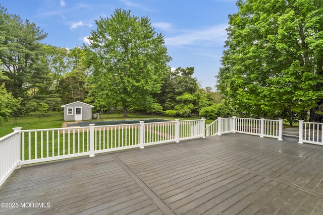 205 Edgemere Dr, Toms River, NJ 08755 - wooden deck featuring an outbuilding, a storage shed, and view of scattered trees