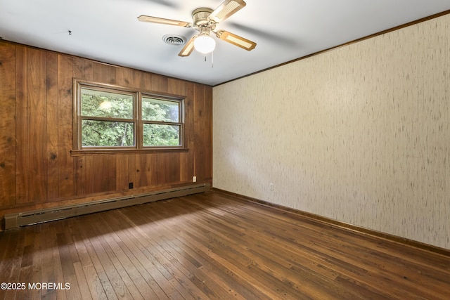 205 Edgemere Dr, Toms River, NJ 08755 - empty room featuring a baseboard radiator, dark wood-type flooring, ceiling fan, and baseboards
