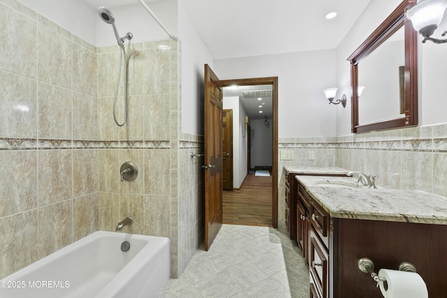205 Edgemere Dr, Toms River, NJ 08755 - bathroom with tile walls, tub / shower combination, tile patterned floors, vanity, and wainscoting