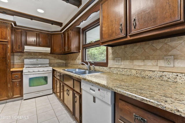 205 Edgemere Dr, Toms River, NJ 08755 - kitchen featuring white appliances, a sink, under cabinet range hood, light tile patterned flooring, and backsplash