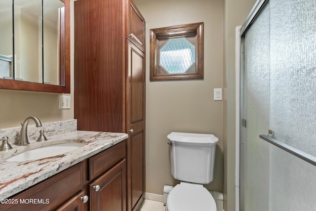 205 Edgemere Dr, Toms River, NJ 08755 - bathroom featuring toilet, vanity, and a shower with shower door