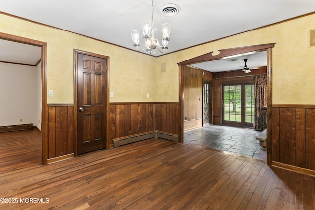 205 Edgemere Dr, Toms River, NJ 08755 - unfurnished dining area featuring hardwood / wood-style floors, a baseboard radiator, a wainscoted wall, wood walls, and a ceiling fan
