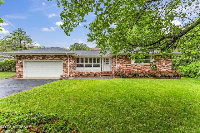 205 Edgemere Dr, Toms River, NJ 08755 - single story home featuring asphalt driveway, an attached garage, a front yard, and brick siding