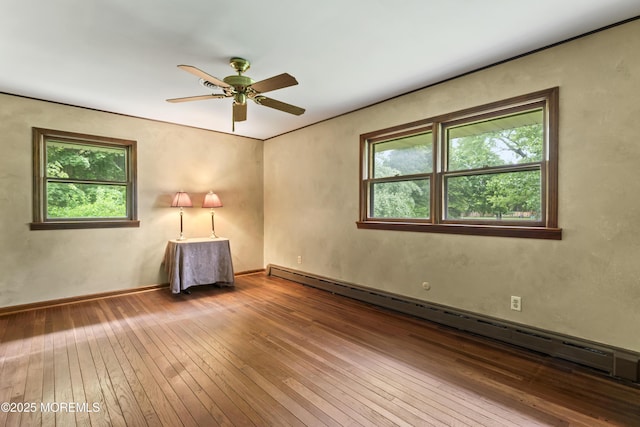 205 Edgemere Dr, Toms River, NJ 08755 - empty room featuring baseboard heating, wood-type flooring, and a ceiling fan