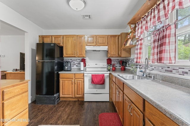 80 Falmouth Ave Unit 72, Whiting, NJ 08759 - kitchen with white range with electric cooktop, freestanding refrigerator, under cabinet range hood, a sink, and decorative backsplash