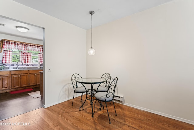 80 Falmouth Ave Unit 72, Whiting, NJ 08759 - dining room featuring wood finished floors, baseboards, and a baseboard radiator