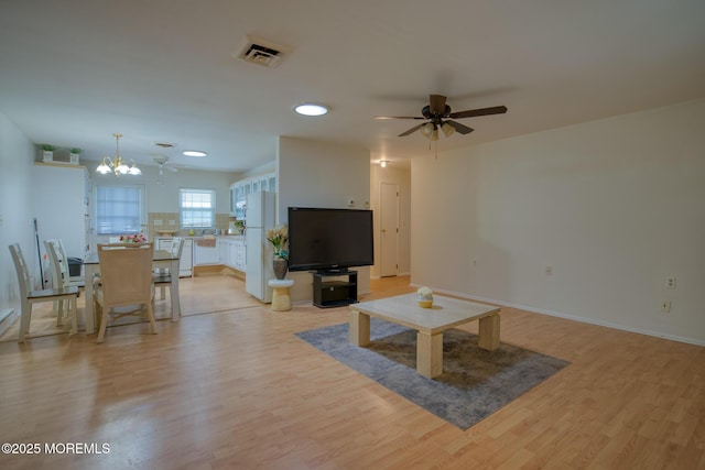 30F Cambridge Ct, Lakewood, NJ 08701 - living room featuring ceiling fan, light wood-style flooring, a chandelier, baseboards, and recessed lighting