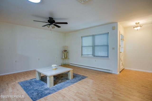 30F Cambridge Ct, Lakewood, NJ 08701 - living area with a baseboard heating unit, light wood finished floors, a ceiling fan, and baseboards