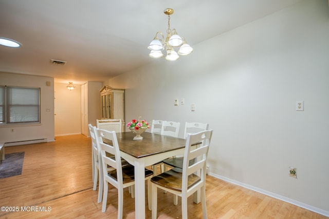 30F Cambridge Ct, Lakewood, NJ 08701 - dining area with light wood-style floors, a chandelier, and baseboards
