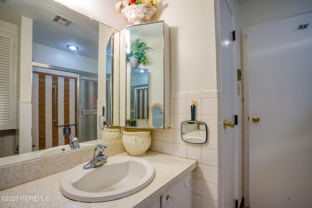 30F Cambridge Ct, Lakewood, NJ 08701 - bathroom with vanity and tile walls