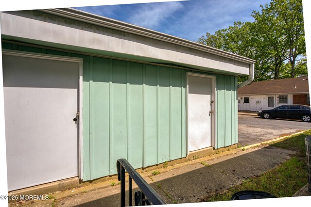 30F Cambridge Ct, Lakewood, NJ 08701 - doorway to property with board and batten siding