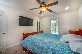 carpeted bedroom with baseboards, ceiling fan, and recessed lighting