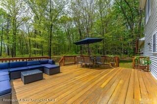 wooden terrace with outdoor lounge area