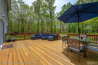 wooden deck featuring an outdoor living space and outdoor dining area