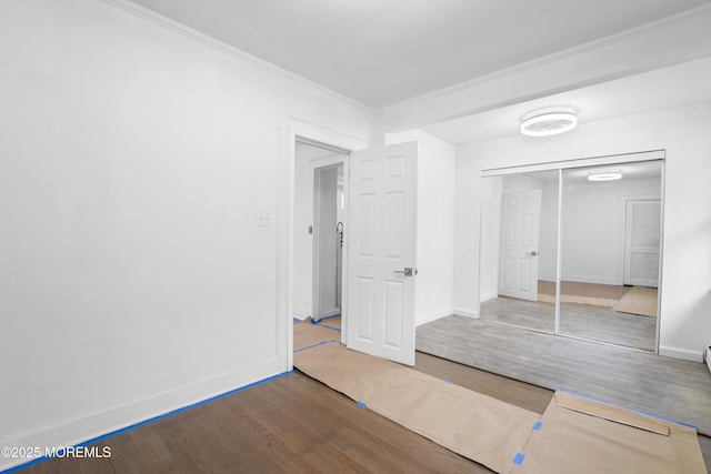 101 Forest Ave, Keansburg, NJ 07734 - unfurnished bedroom featuring wood finished floors, ornamental molding, baseboards, and a closet