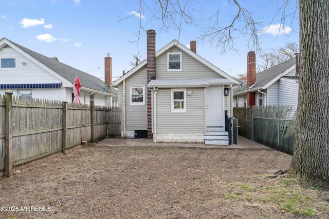 101 Forest Ave, Keansburg, NJ 07734 - back of property featuring entry steps, a fenced backyard, and a chimney