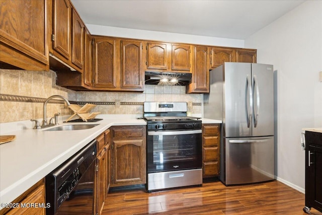 30 Chinkaberry Ct, Howell, NJ 07731 - kitchen with appliances with stainless steel finishes, under cabinet range hood, a sink, and light countertops