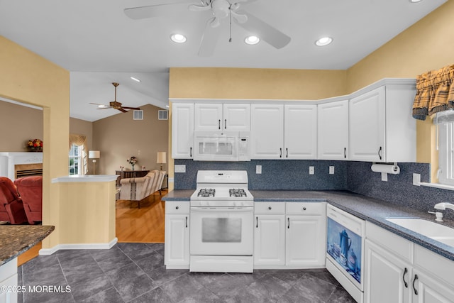 4 Saxony Cir, Manchester, NJ 08759 - kitchen featuring white appliances, ceiling fan, a sink, lofted ceiling, and white cabinetry
