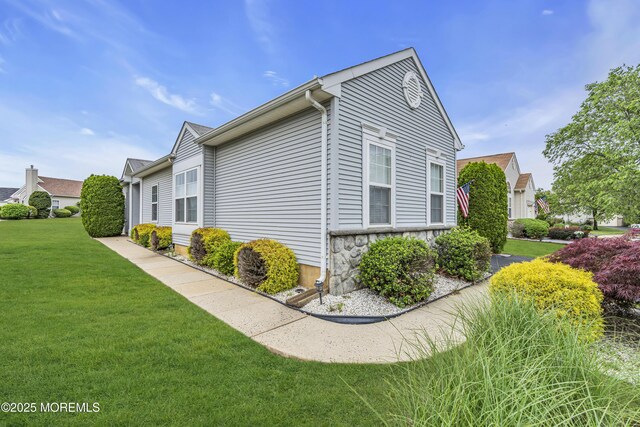 4 Saxony Cir, Manchester, NJ 08759 - view of side of home with a lawn