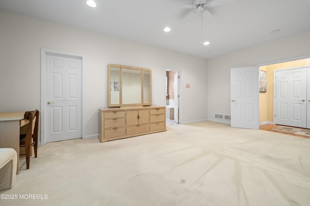 unfurnished bedroom featuring light colored carpet, baseboards, recessed lighting, connected bathroom, and ceiling fan